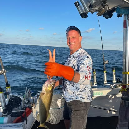 Guest with walleye on the fishing deck
