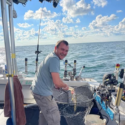 Guest netting a fish