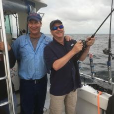 Two people aboard a Sara J charter boat in its FishingBooker operator profile photo